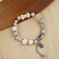 Handmade ceramic bracelet with purple beads, flower charms and auspicious silver pendants - 1765-04 Fairy Luck