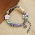 Ethnic ceramic beaded bracelet with floral charms and vintage metal feather pendant - 1765-05 Fairy Ruyi