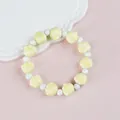Ceramic beaded bracelet featuring pale yellow cat paw charms and white glossy round beads - 1746-04 Yellow Paw