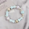Ceramic beaded bracelet with blue bone and purple star charms for women and teens - Puff Dumpling Style (1732-02)