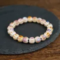 Ceramic beaded bracelet with iridescent cream pearls and elegant rainbow glaze finish - Spiral Purple Style (1777-02)