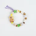 Beaded ceramic bracelet featuring a cute capybara pendant with purple tassel accents - Sea Bream Bear Style (1688-02)