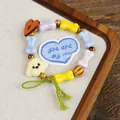 Ceramic beaded bracelet with yellow bone beads and cute beige poodle dog pendant - Milk Cake Puppy Style (1730-01)