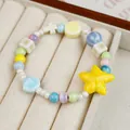 Pastel beaded ceramic bracelet featuring yellow star and light blue starfish charms - Starfish Dudu Multicolor Style (1756-01) / Macaron Multi-Color