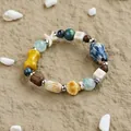Bohemian ceramic bracelet with blue beads, starfish charms, and sea shell accents - To Sea Beach Holiday Style (1752-02) / Sea Blue and Yellow