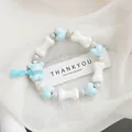 Blue ceramic beaded bracelet with heart, bear charm and soft blue tassel detail - Waxy Bear Style (1742-03) / Sky Blue