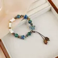 Handmade ceramic bracelet with blue and green star beads on woven cord - Butterfly Style (1751-02) / Teal