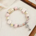 Beaded ceramic bracelet with pink butterfly and silver bell charm on linen - Fortune Fairy Style (1765-02) / Multicolor