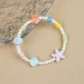 Ceramic beaded bracelet featuring colorful ocean shells and starfish charms in summer style - Beach Star Style (1756-07) / White