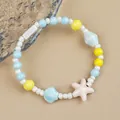 Ceramic beaded ocean bracelet with blue starfish and yellow beads in a summer style - Sea Salt Candy Style (1756-06) / Light Blue & Yellow