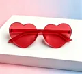 Translucent heart-shaped sunglasses in vibrant red jelly color for parties - Kids Heart Red