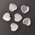 Set of six heart-shaped selenite stones with cat-eye effect on dark texture - Milky White Cat Eye