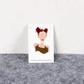 Minimalist silver stud earrings displayed on an elegant fashion illustration card - 6x9cm