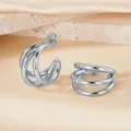 Chic triple-layered C-shaped silver hoop earrings with a polished metallic finish - Silver