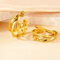 Three-layered C-shaped hoop earrings in shiny gold finish on a textured stone base - Triangular Wire Large Size / Gold