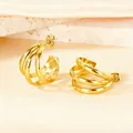 Elegant gold layered C-shape hoop earrings displayed on a natural stone background - Semi-circular Wire Small Size / Gold