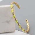 Adjustable gold-plated twisted cuff bracelet with yellow enamel and micro zircons - Yellow