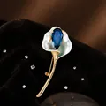 Elegant gold calla lily brooch with dark blue teardrop gemstone and pearl enamel - Calla Lily Brooch (XZ1628-1)