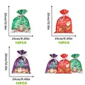 Set of 10 drawstring Christmas gift bags with Santa and reindeer in red green and purple - Rope Tying Set 9 (30 Pieces)