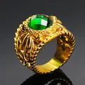 Macro detail of vintage gold ring with large emerald green gem and embossed texture - Gold Green Zirconia