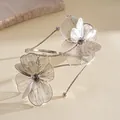 Detailed view of silver filigree flower petals on elegant metallic open arm cuff - Opening Style (HB5746) / Silver