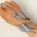 Close-up of sculptural silver bracelet and ring set with abstract flowing lines - Bracelet and Ring Set in Silver (A-362+A-364)