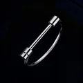 Detailed view of silver minimalist titanium steel bracelet with cylindrical T-bar accents - One Size / Silver