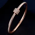 Luxurious rose gold titanium steel bracelet with pavé diamond rings and horseshoe design - One Size / Rose Gold