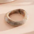 Chic marble pattern resin bangle with an irregular geometric rounded shape in beige - White