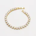 Golden tennis bracelet featuring sparkling heart-shaped cubic zirconia in a claw setting - Bracelet / Gold