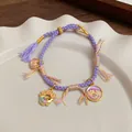 Bracciale viola intrecciato a mano con ciondoli placcati oro 18K e pesce koi - Viola (Pesce smaltato fatto a mano e lucchetto della pace)