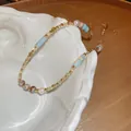 Dettaglio collana di perline in acciaio inox con finiture in blu e oro elegante - Collana N. 14 - Colorata - Pietra Naturale