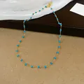 Vista dettagliata della chic collana in acciaio inossidabile dorato con perline blu - 29# Collana - Ciondolo Rotondo a Perline Blu