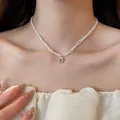 Detailed shot of double-strand pearl necklace with square pink zircon pendant on neck - Style 31