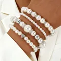 Four-piece white pearl bracelet set with silver heart pendant on a female model - 4-Piece Heart Pendant Style (5648) / Silver With Artificial Pearl White