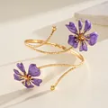 Detail of golden spiral arm cuff with intricate purple enamel flowers - Floral (HB5775) / Purple