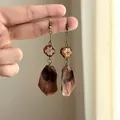 Detailed view of handmade ethnic style earrings featuring natural dried fruit materials - Plant Pod Wooden Style (8#)