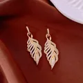 Elegant gold leaf drop earrings encrusted with sparkling white cubic zirconia stones - Leaf Pendant Style