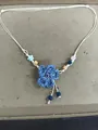 Blue hand-woven flower necklace with beads on a white cord for summer resort style - Necklace / Blue