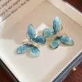Exquisite sea blue enamel butterfly stud earrings with sparkling white zircon gems - Butterfly Style (Copper) / Silver Needle / Gold/Blue