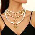 Collana a tre strati a tema oceano con stelle marine, conchiglie e perle bianche - Stile Oceano Conchiglia Coda di Balena a Tre Strati (A-1127)