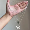 Detailed view of vintage triple layered necklace with butterfly and teardrop pendants - Layered Butterfly Drop Necklace / Silver Plated Green