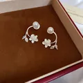 Elegant C-shaped silver floral earrings with white pearls and sparkling diamond accents - Silver Earring Post Style