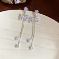 Elegante silberne Schleifen-Ohrhänger mit funkelnden Kristallquasten für Abendpartys. - Schleife Lange Quaste Stil (17#)