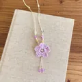 Handmade lavender crochet flower necklace detail showcasing delicate woven texture - Purple