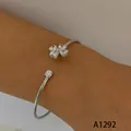 Minimalist silver stainless steel open cuff bracelet with sparkling crystal clover motif - Four-Heart Rhinestone Clover Style (A1292) / Silver