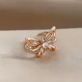 Elegant rose gold plated butterfly ring with sparkling zircon center on silk background - Ring (Adjustable) / Light Coffee Gold