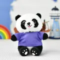 Cuddly panda plush toy wearing a small purple t-shirt sitting on a white surface - Sitting Panda - Bead Chain Ornament / Purple