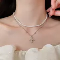 Close-up detail of double layer necklace with pearls and rhinestone flower pendant - Style 23
