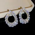 Prachtige zilveren oorbellen met glanzende strass steentjes in een vintage bloemig design - Stijl 32 (HE32568)